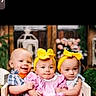 Fischer is registered to the contest to win money with this photo: babies, baby, bow_headband, child, cute, decor, flowers, group, lantern, orange_shorts, pink_dress, plaid_shirt, portrait, sitting, smiling, socks, toddler, wooden_background, wooden_crate, yellow_headband