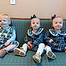 bench, blue, bow, children, cute, family, green, group, indoor, overalls, patterned_upholstery, plaid_dress, portrait, shoes, sitting, smile, socks, toddler, wall_outlet, young_child