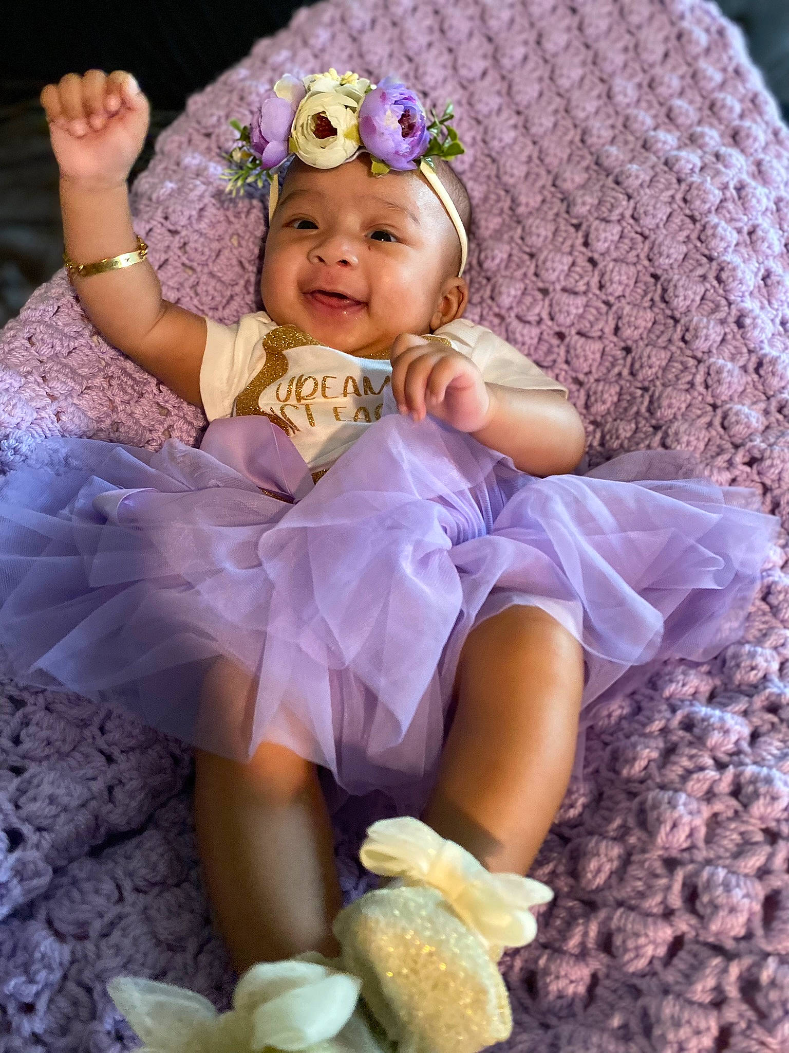 Jream is registered to the contest to win money with this photo: baby, baby_toddler_clothing, beauty, child, dress, embellishment, happy, headgear, headpiece, headwear, iris, person, petal, pink, plant, purple, skin, smile, textile, toddler