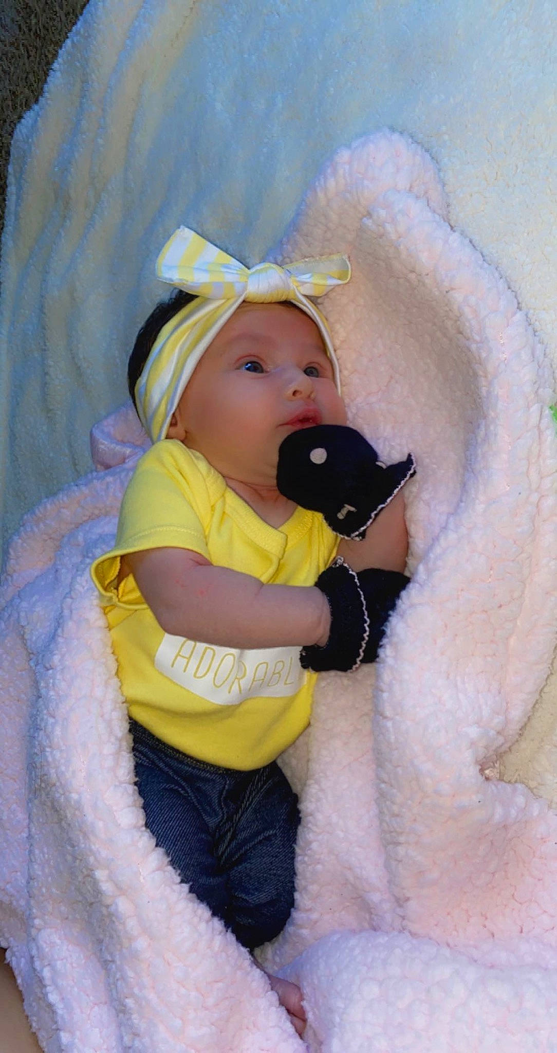 Kylah is registered to the contest to win money with this photo: baby, baby_products, baby_sleeping, baby_toddler_clothing, child, comfort, costume, fun, fur, headwear, linens, pattern, person, personal_protective_equipment, plush, sitting, skin, sleeve, stuffed_toy, teddy_bear