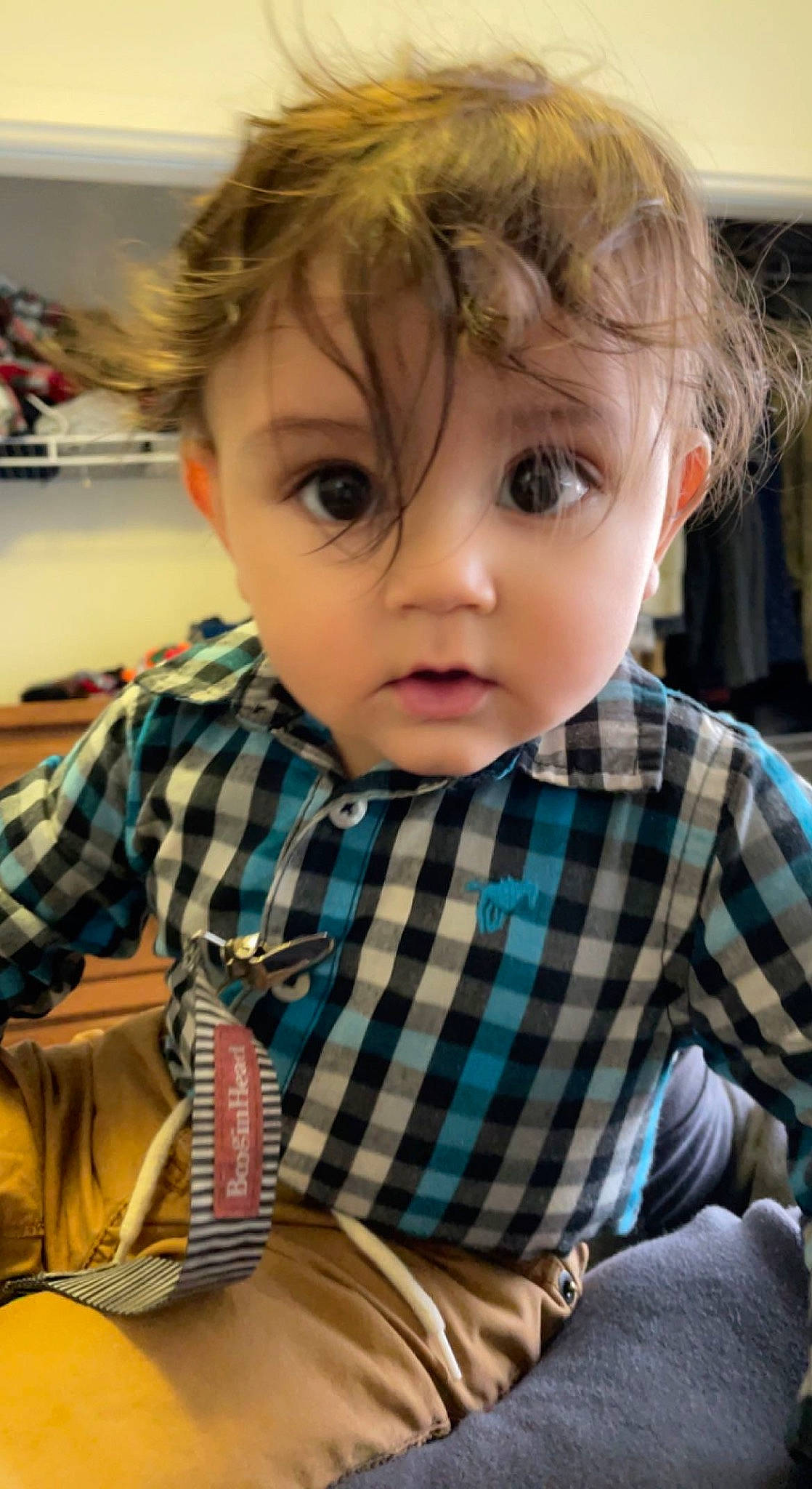 Andre is registered to the contest to win money with this photo: baby_toddler_clothing, bangs, blond, brown_hair, cheek, child, fun, hair, hairstyle, happy, iris, nose, pattern, person, plaid, sitting, skin, sleeve, t_shirt, tartan