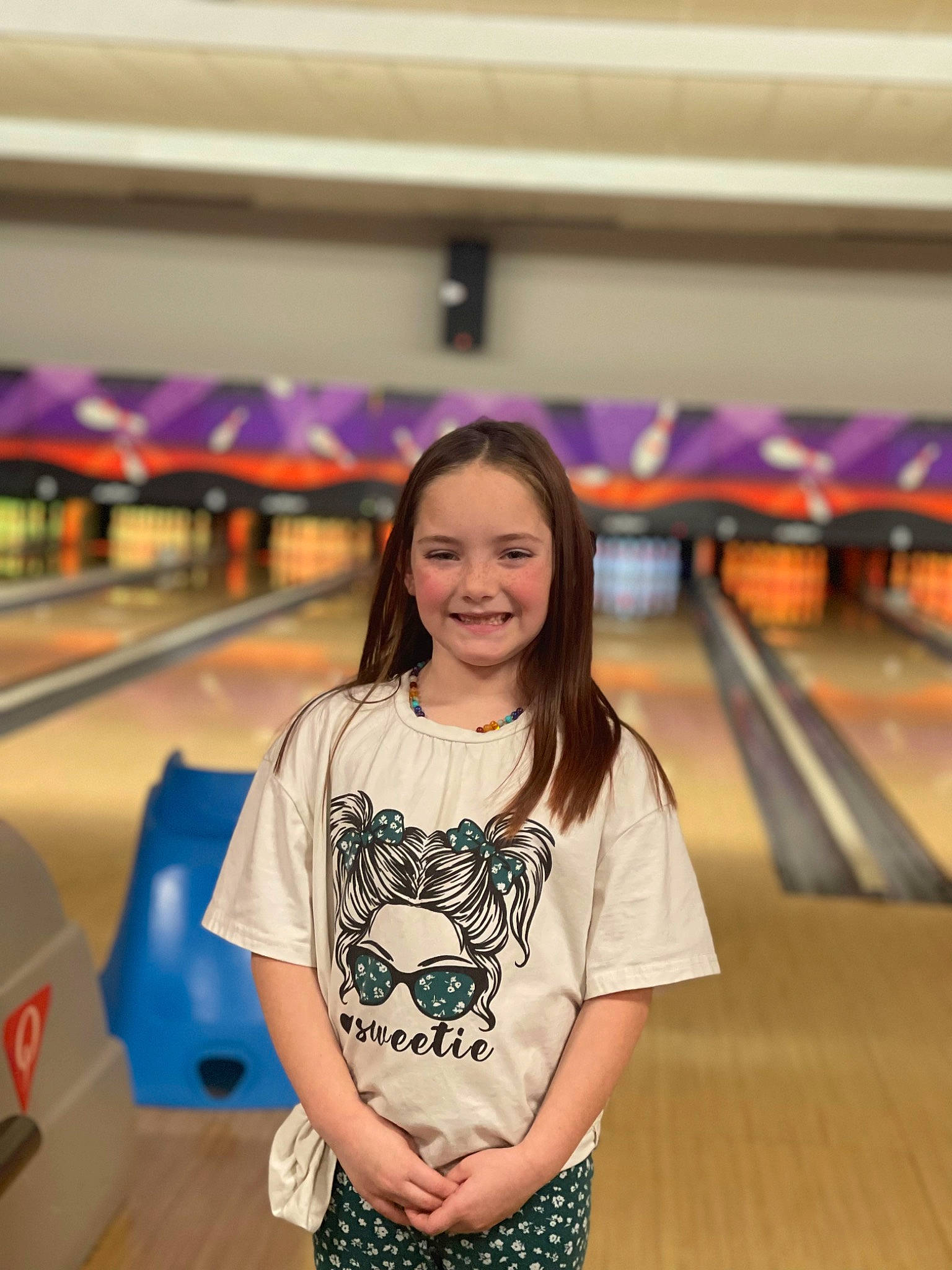 Saphira is registered to the contest to win money with this photo: bowler, bowling, bowling_ball, bowling_equipment, bowling_pin, duckpin_bowling, flooring, fun, happy, hardwood, indoor_games_and_sports, joy, leisure, person, red, skin, smile, sports_equipment, standing, ten_pin_bowling