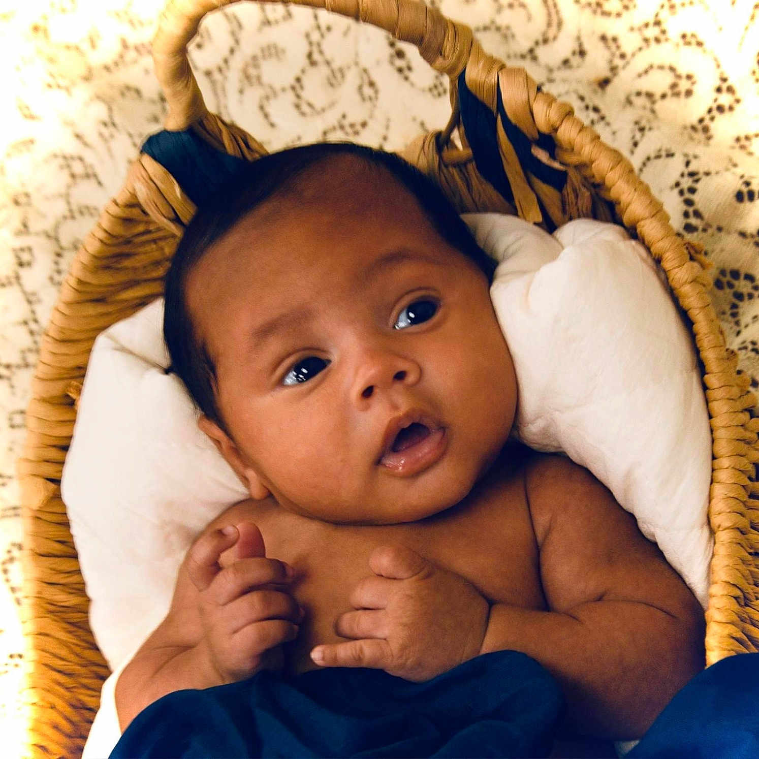 Jaylin is registered to the contest to win money with this photo: baby, basket, bed, blanket, cradle, crib, cushion, face, furniture, happy, head, homedecor, infantbed, newborn, person, photography, portrait, quilt, sleeping, smile