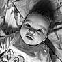 Owen participe au concours pour gagner de l'argent avec cette photo : baby, black_and_white, blanket, cartoon_character, child, clothing, curly_hair, cute, expression, eyes, face, indoors, infant, lying_down, person, portrait, smile, soft_light, toddler, young