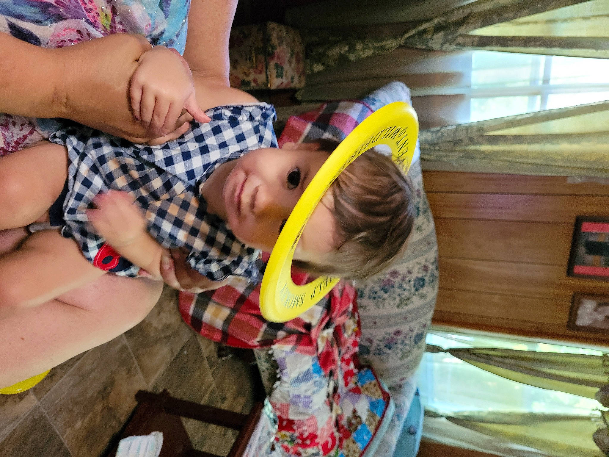 Marina is registered to the contest to win money with this photo: baby, baseball_cap, cap, child, finger, fun, happy, hat, human_leg, leisure, mouth, pattern, person, personal_protective_equipment, shorts, smile, sun_hat, t_shirt, thigh, toddler