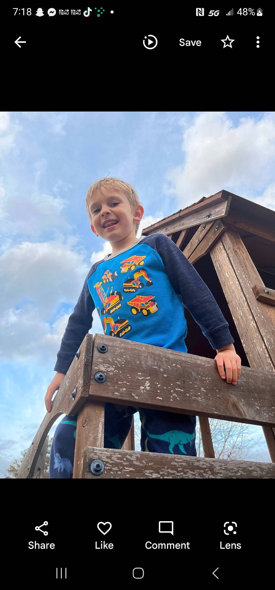 Phillip is registered to the contest to win money with this photo: azure, child, city, cloud, electric_blue, flash_photography, fun, grass, happy, joy, leisure, outdoor_play_equipment, person, recreation, sitting, sky, smile, standing, t_shirt, toddler