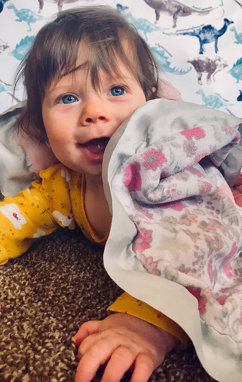Mara Evangelene joined the competition — help win amazing prizes! baby_toddler_clothing, bangs, child, companion_dog, eye, fun, fur, grass, hand, happy, human_body, linens, pattern, person, play, portrait_photography, sitting, skin, textile, toddler