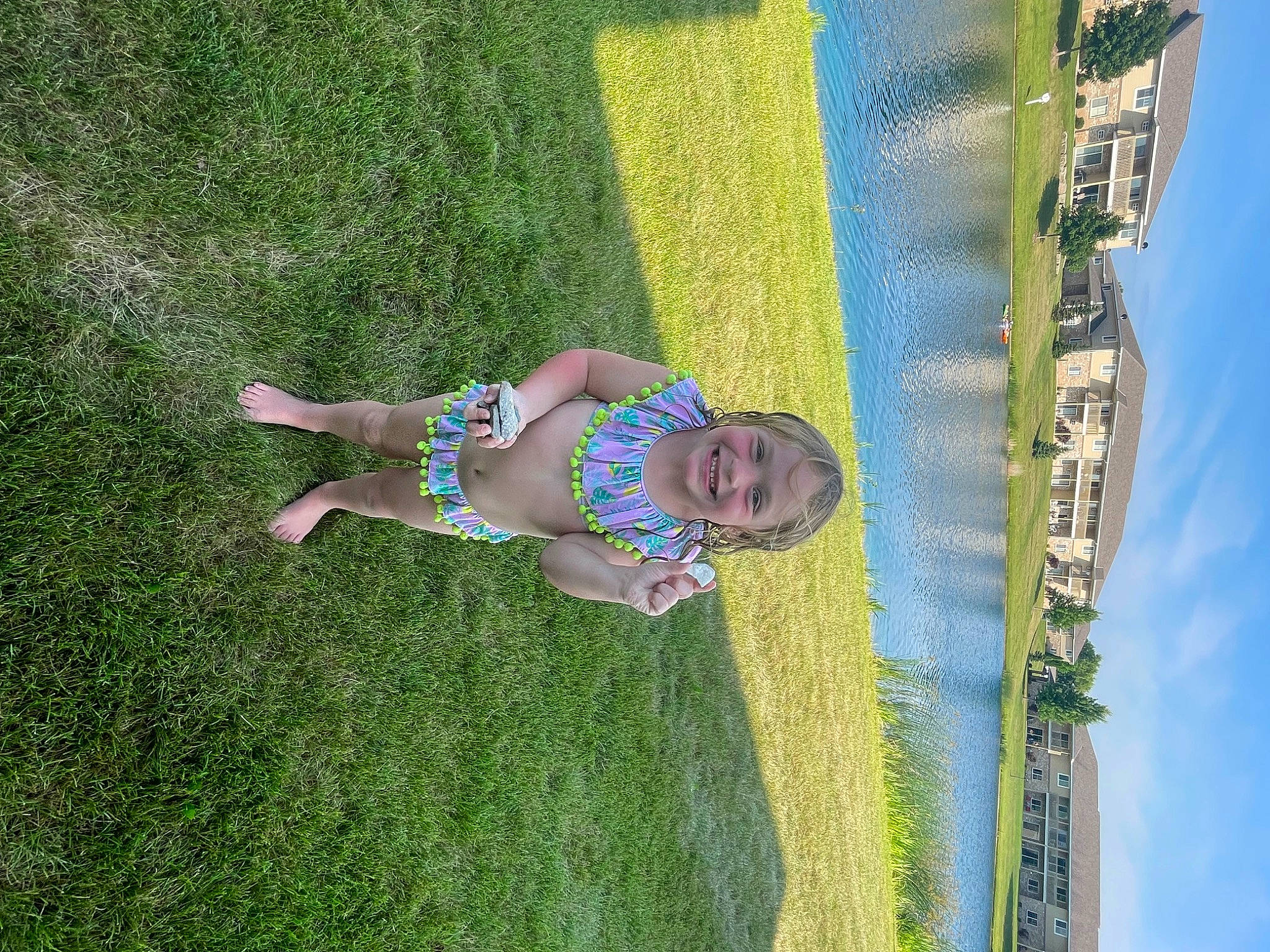 Vivian is registered to the contest to win money with this photo: baby, electric_blue, fun, garden, grass, grass_family, grassland, happy, joy, landscape, lawn, leisure, people_in_nature, person, plant, recreation, sky, smile, spring, toddler