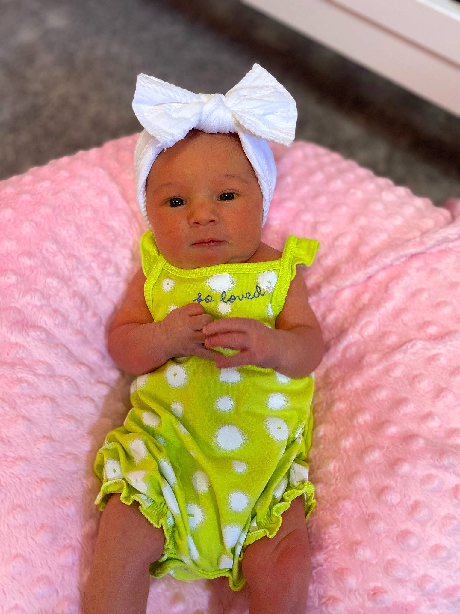 Parker joined the competition — help win amazing prizes! baby, baby_products, baby_toddler_clothing, cap, child, day_dress, dress, happy, hat, linens, magenta, one_piece_garment, pattern, person, pink, purple, sitting, skin, sleeve, textile