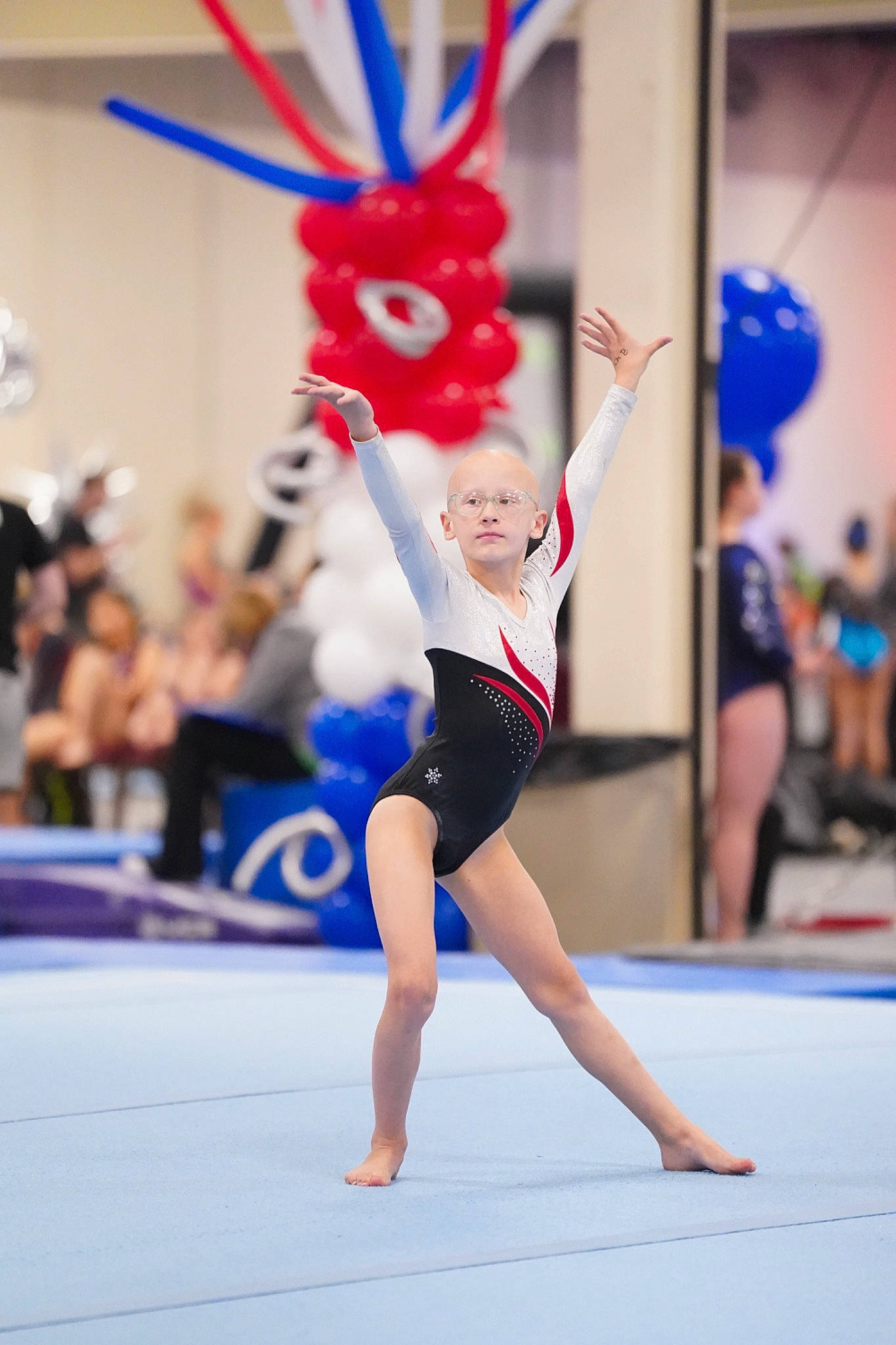 Nella is registered to the contest to win money with this photo: artist, artistic_gymnastics, balance, barefoot, blue, championship, competition_event, dance, electric_blue, entertainment, event, fun, gymnastics, human_leg, leotard, performing_arts, person, rhythmic_gymnastics, sports, sportswear