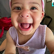 Elizabeth is registered to the contest to win money with this photo: baby, child, smiling, face, headband, pink, purple, indoors, portrait, joy, happiness, toddler, cute, person, closeup, apparel, clothing, skin, expression, infant