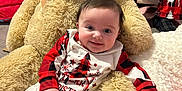 Ivy-Rae joined the competition — help win amazing prizes! baby, blanket, child, christmas, cozy, cute, decor, floor, furniture, holiday, indoor, pajamas, person, plush, red, smiling, soft, teddy_bear, toy, white