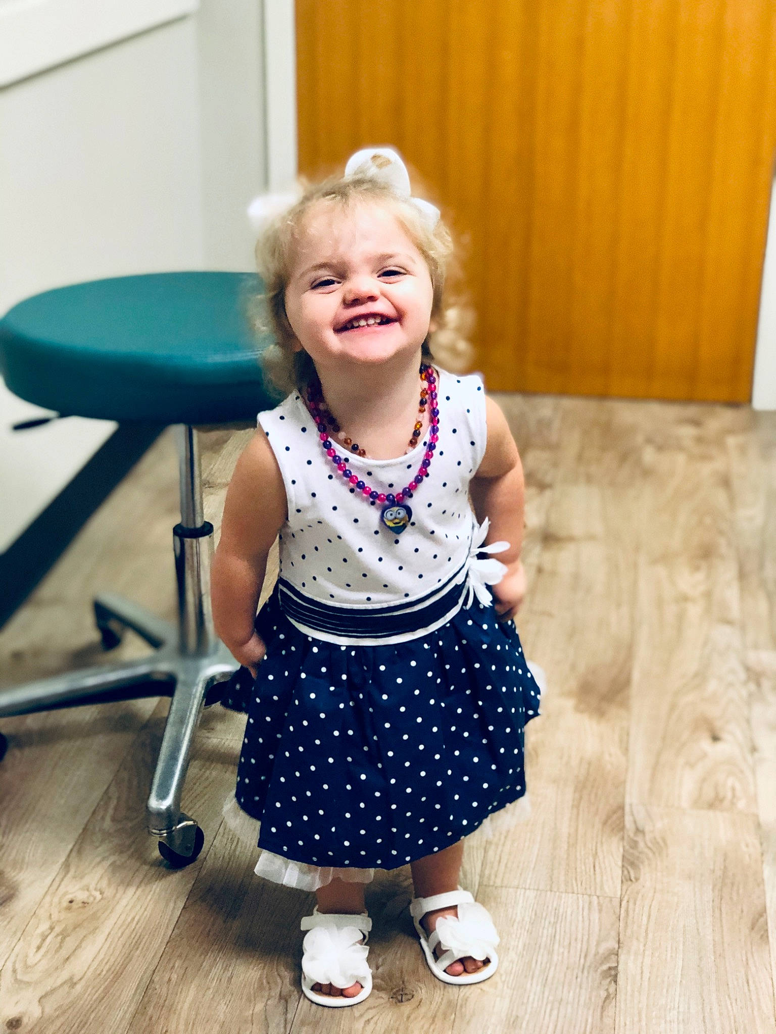 Autumn is registered to the contest to win money with this photo: blond, chair, child, child_model, design, dress, facial_expression, happy, joy, laugh, pattern, person, play, polka_dot, product, purple, shoe, sitting, smile, toddler