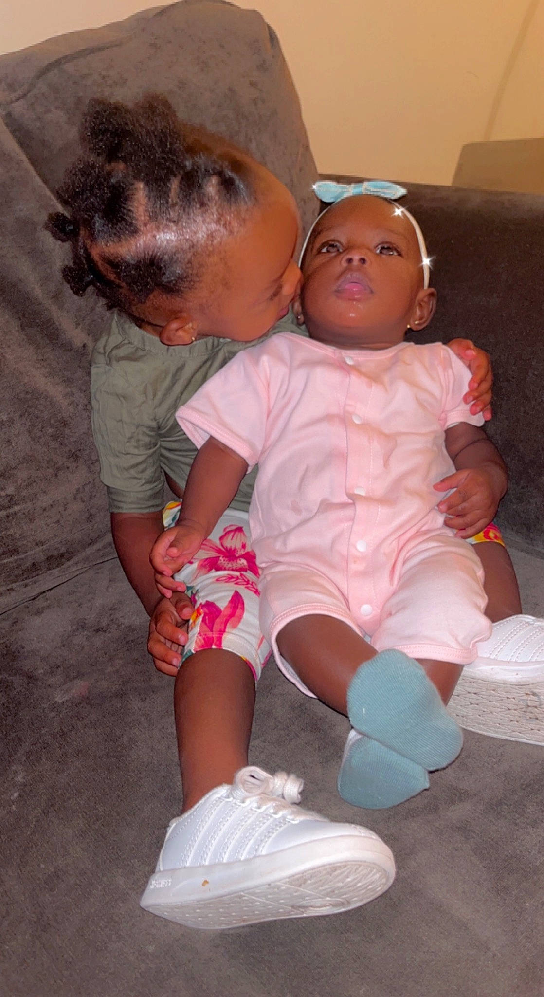 Foreva' is registered to the contest to win money with this photo: baby, baby_toddler_clothing, child, doll, finger, foot, fun, happy, human_leg, joint, knee, lap, leg, mouth, person, pink, sitting, skin, sock, thigh