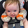 Emma joined the competition — help win amazing prizes! baby, child, car_seat, neck_pillow, fox_pattern, smiling, happy, infant, seatbelt, cute, face, clothing, blue_pants, floral_top, safety, car, travel, comfort, portrait, closeup