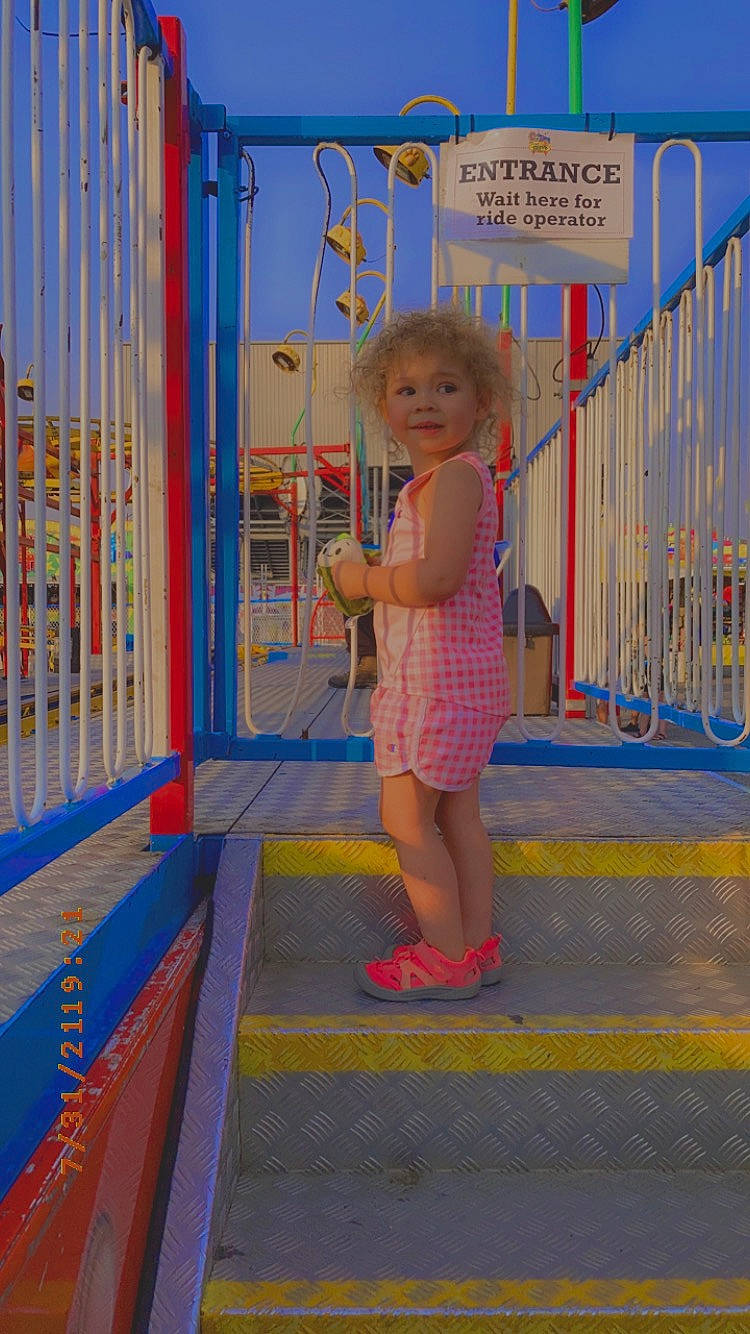 Azaliyah is registered to the contest to win money with this photo: baby, child, city, electric_blue, flooring, fun, hat, human_leg, human_settlement, leg, leisure, magenta, person, pink, play, recreation, sandal, standing, sun_hat, toddler