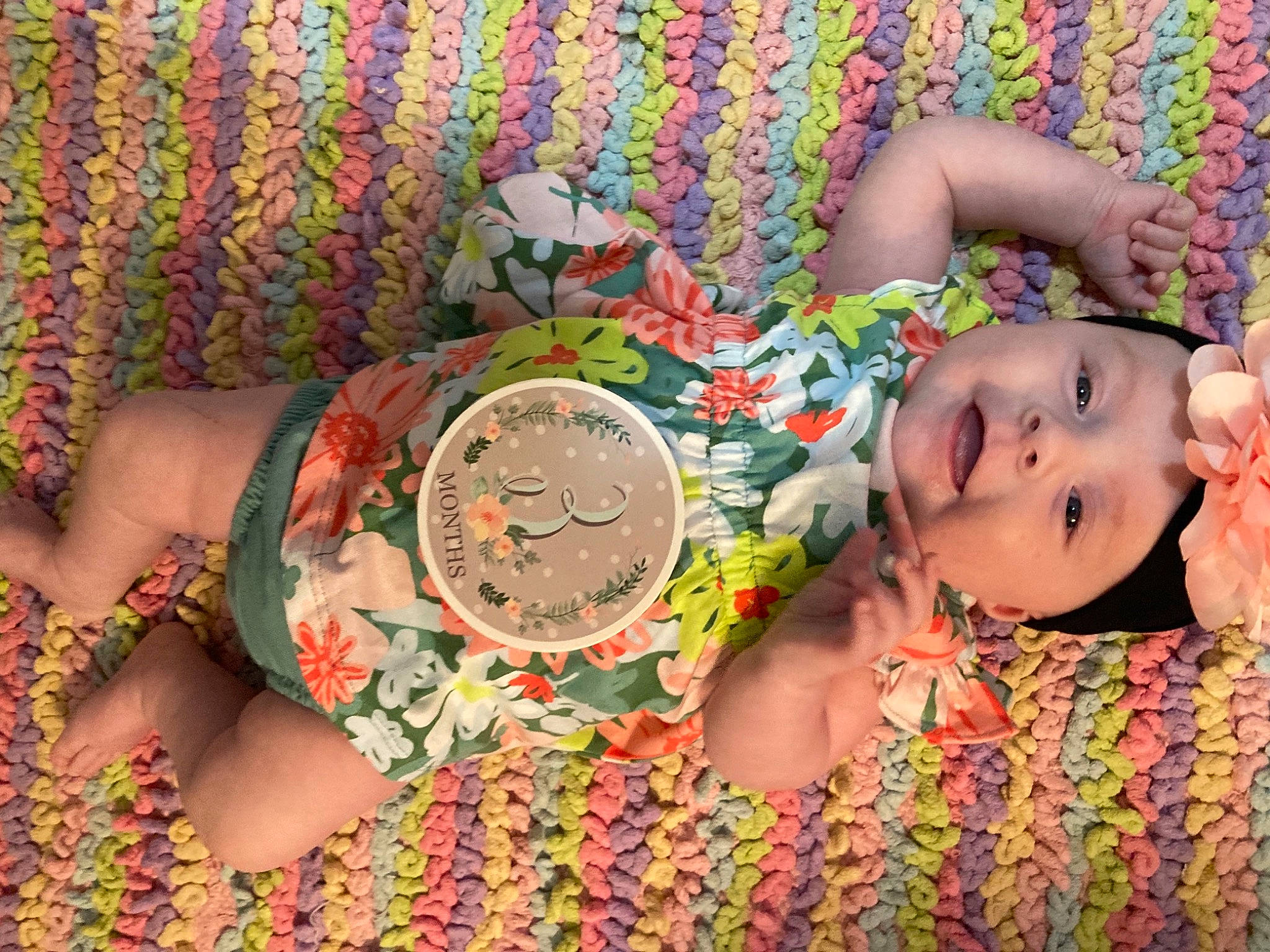 Gracelynn is registered to the contest to win money with this photo: adaptation, baby, baby_toddler_clothing, child, fun, glasses, grass, happy, headwear, human, human_body, leaf, linens, orange, pattern, people_in_nature, person, pink, plant, sunglasses