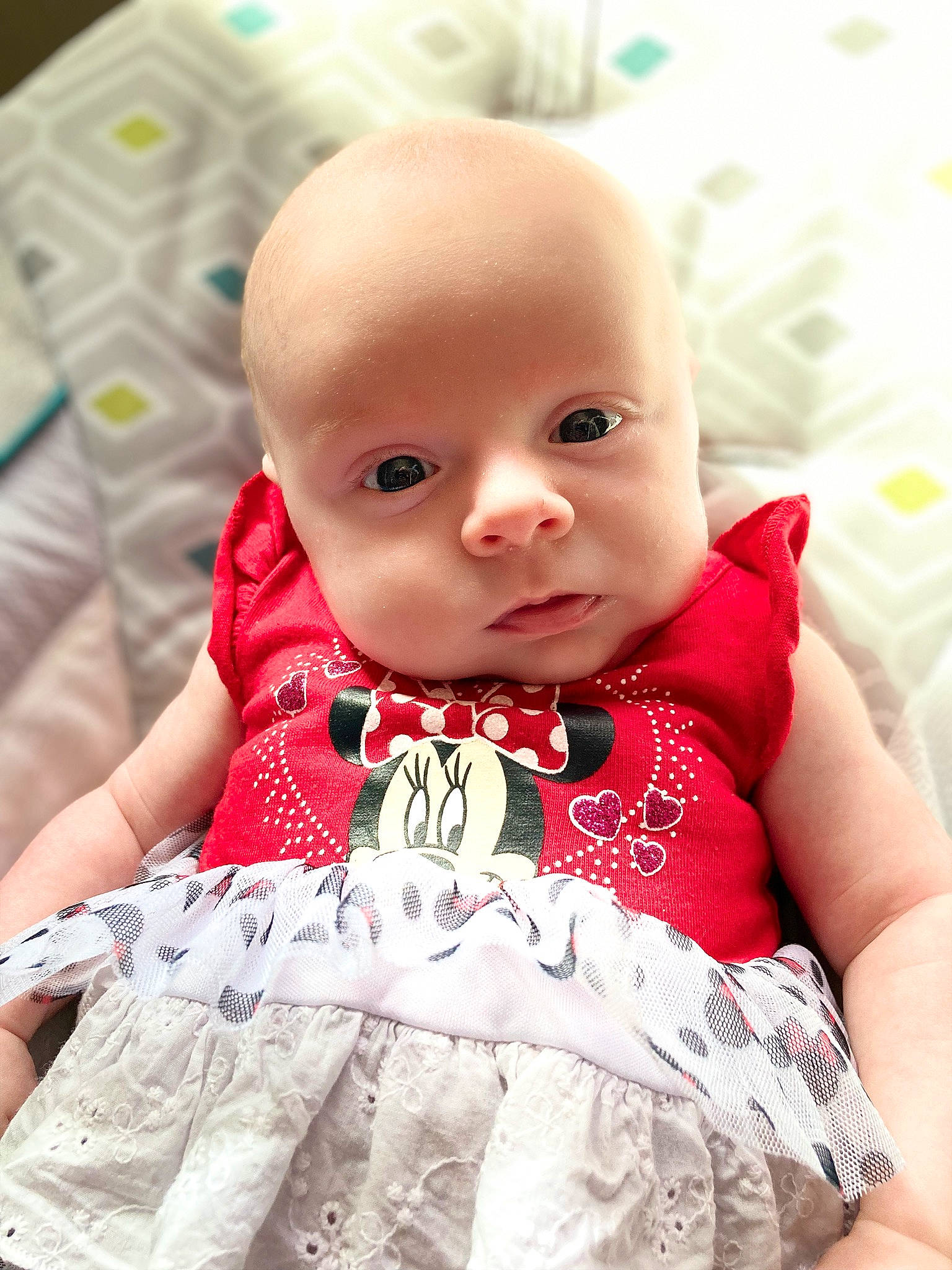 Gracelynn is registered to the contest to win money with this photo: baby, baby_toddler_clothing, cheek, child, collar, day_dress, dress, eye, eyelash, happy, head, iris, linens, lip, pattern, person, sitting, skin, sleeve, t_shirt