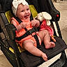 Néllya a rejoint le concours — aidez-le/la à gagner de superbes lots ! baby, baby_girl, black_stroller, bow, bunny, child, cuteness, floor, footwear_absent, happy, headband, indoor, infant, orange_clothing, person, plush_toy, seatbelt, smiling, stroller, toy