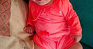Néllya participe au concours pour gagner de l'argent avec cette photo : baby, bright, casual, child, coral_clothing, couch, cute, face, happy, indoors, infant, one_person, person, pillow, portrait, relaxed, sitting, skin, smiling, young