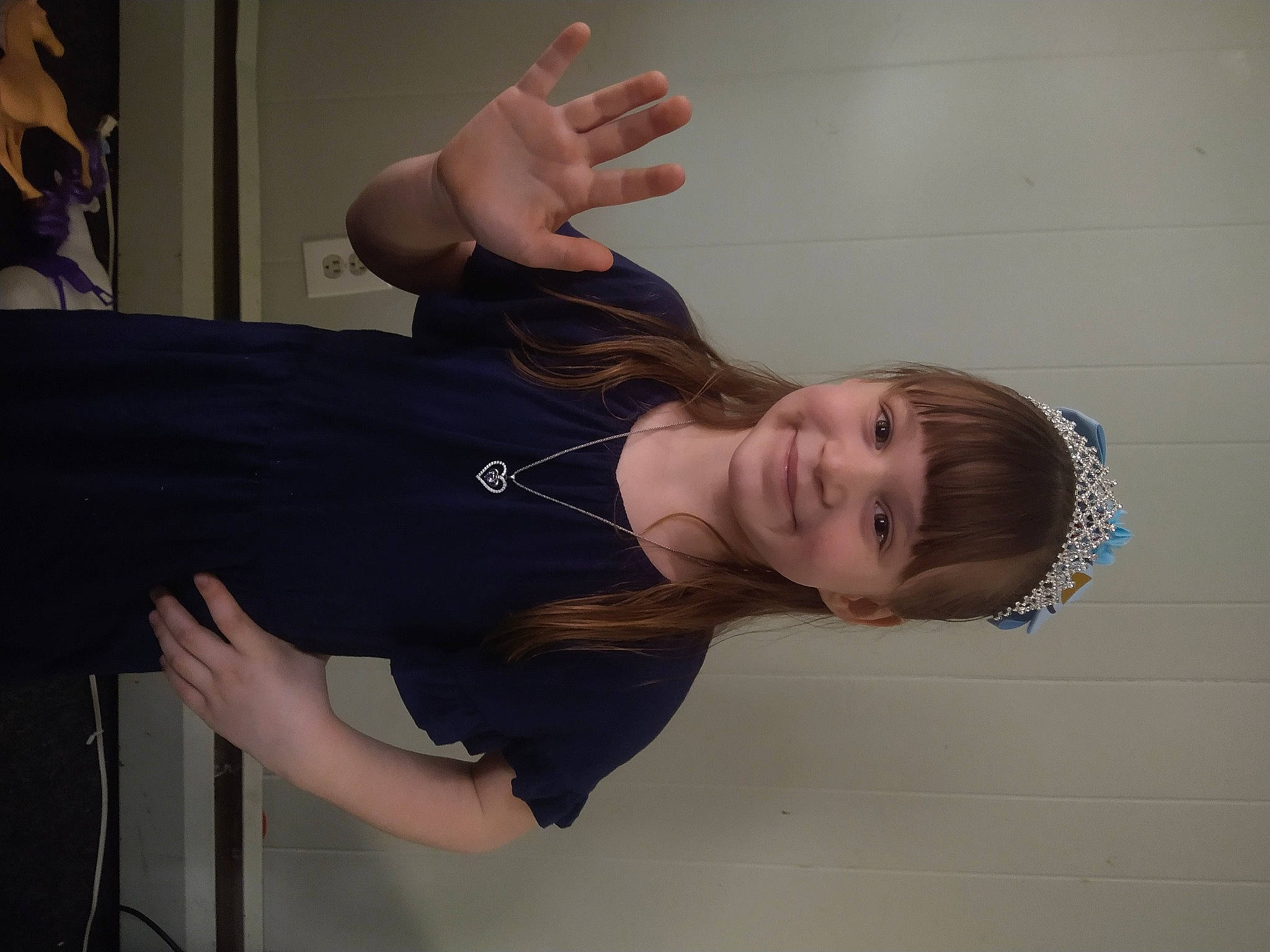 Lilliana is registered to the contest to win money with this photo: balance, chest, elbow, finger, fun, gesture, hip, human_leg, joint, joy, knee, neck, person, room, shoulder, sitting, sleeve, sportswear, thigh, thumb