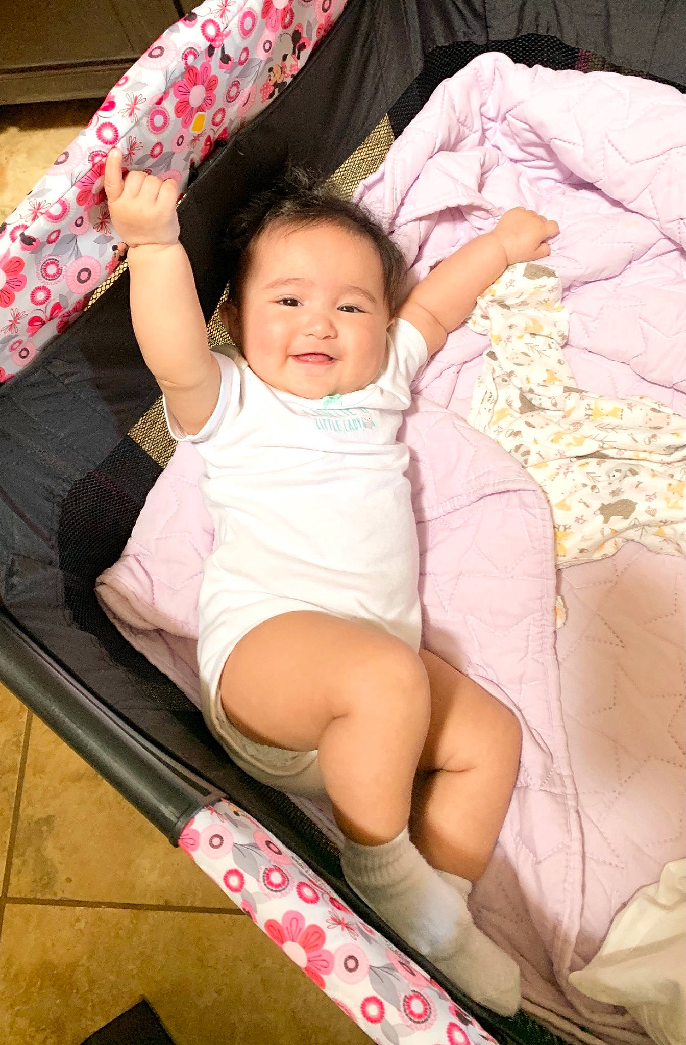 Macy is registered to the contest to win money with this photo: arm, baby, baby_toddler_clothing, cheek, comfort, eye, hand, happy, human_body, human_leg, joy, lap, leg, neck, person, pink, skin, sleeve, sock, textile