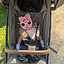 baby, stroller, sunglasses, bow, pink, clothing, gloves, seatbelt, outdoor, grass, gravel, child, person, fashion, accessory, cute, summer, shade, baby_girl, portrait