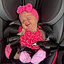 baby, infant, car_seat, pink_clothing, headband, smiling, sleeping, child, safety_harness, cute, adorable, seatbelt, toddler, car, young_child, portrait, happy, comfort, resting, baby_girl