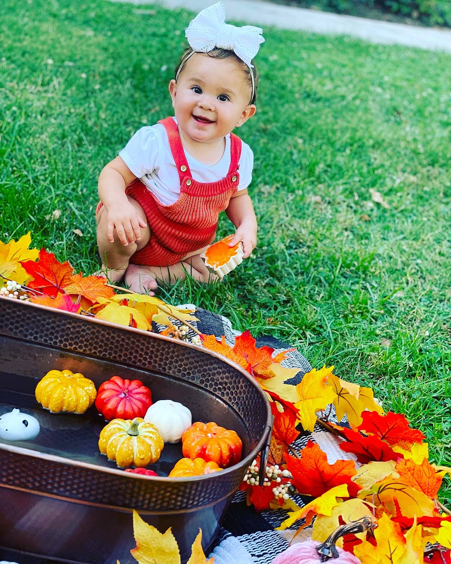 Adelynn is registered to the contest to win money with this photo: baby_toddler_clothing, child, cuisine, food, fruit, fun, grass, happy, joy, leisure, natural_foods, orange, people_in_nature, person, plant, produce, recreation, smile, toddler, vegetable