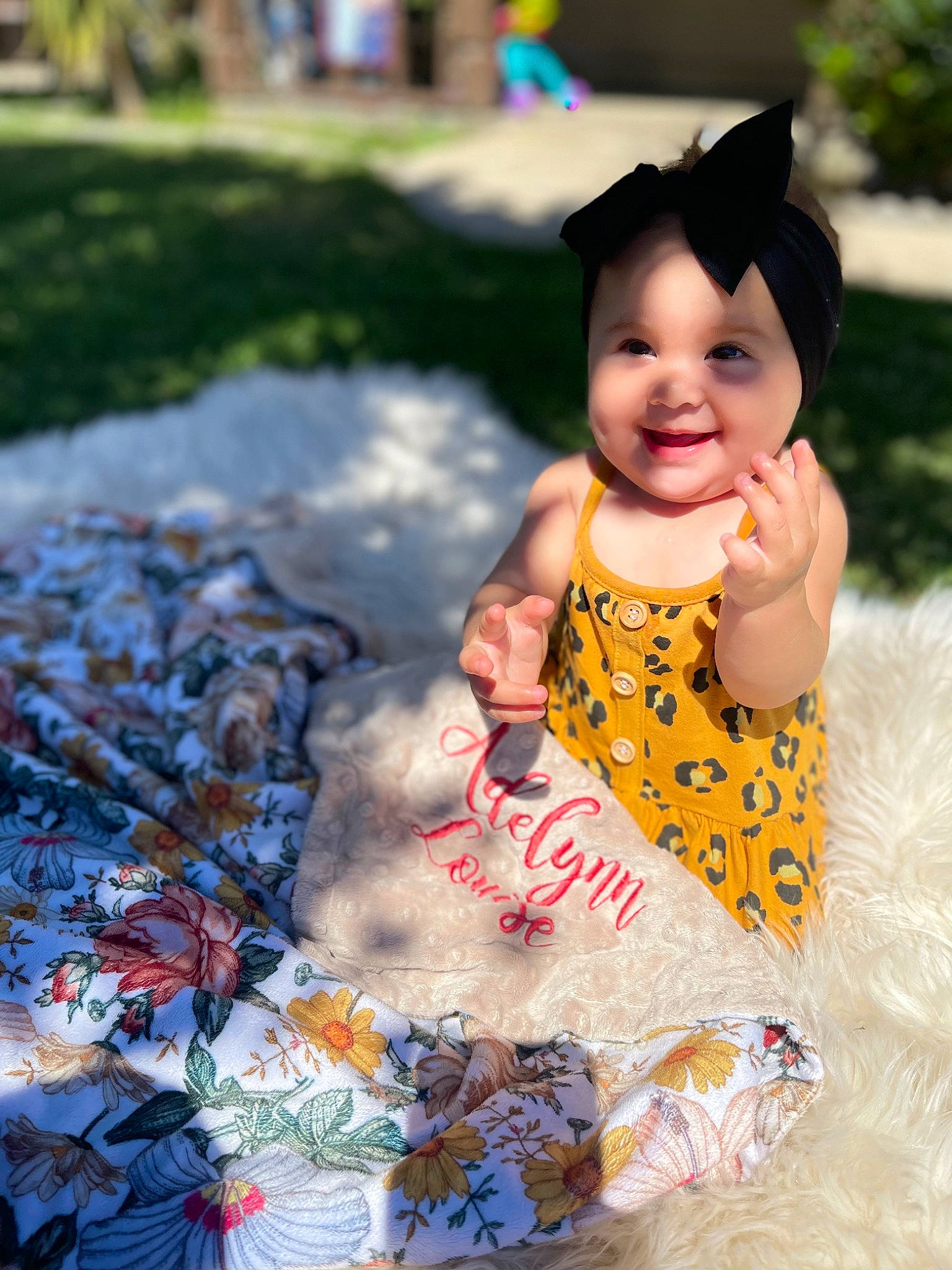 Adelynn joined the competition — help win amazing prizes! baby, baby_toddler_clothing, child, costume, dress, eye, fun, grass, happy, joy, leisure, pattern, people_in_nature, person, plant, play, recreation, sitting, skin, smile