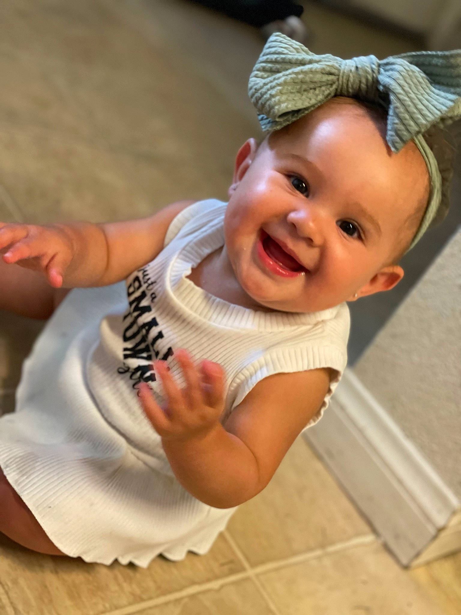Adelynn joined the competition — help win amazing prizes! abdomen, baby, baby_toddler_clothing, child, eye, fashion_accessory, finger, flooring, fun, gesture, hand, happy, head, headgear, human_leg, joy, person, skin, smile, thigh