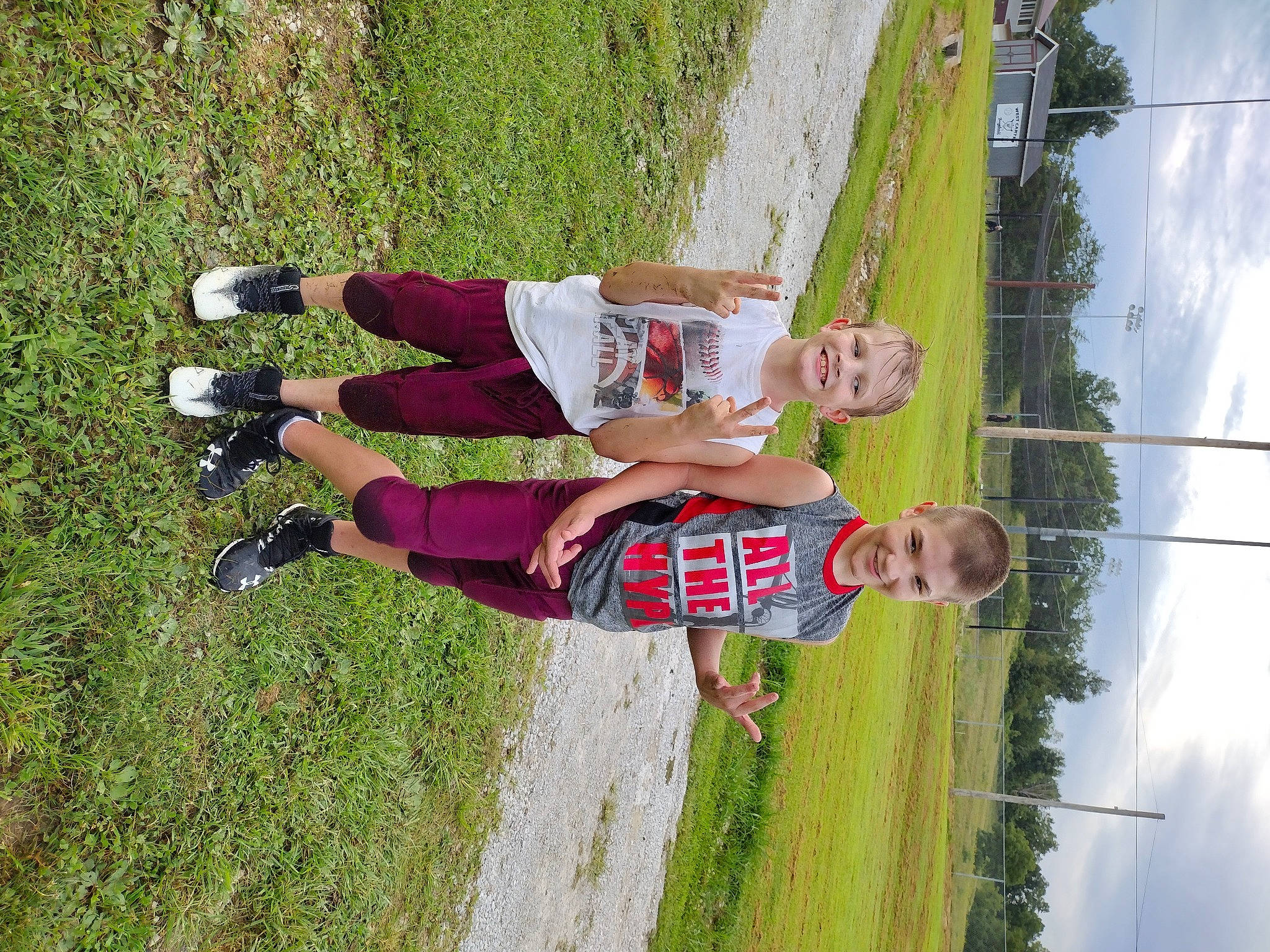 Jackson is registered to the contest to win money with this photo: adventure, cloud, competition_event, fun, grass, happy, joy, knee, leisure, people_in_nature, person, plant, pole, recreation, shorts, sky, smile, sports, sports_uniform, spring