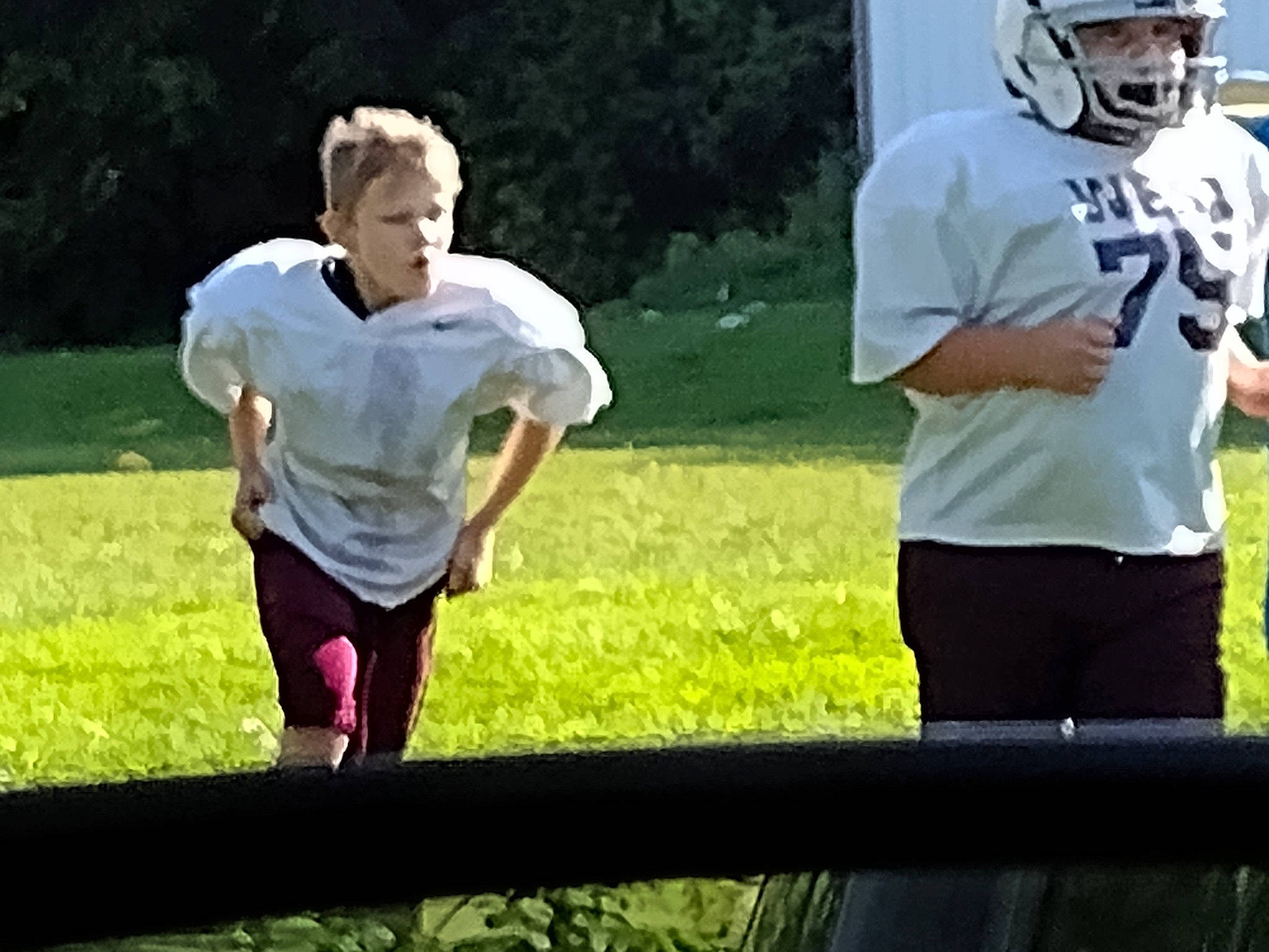 Jackson joined the competition — help win amazing prizes! competition_event, football_equipment, football_gear, football_helmet, fun, gesture, grass, happy, helmet, jersey, leisure, person, player, recreation, shorts, sports, sports_equipment, sports_gear, sports_uniform, t_shirt