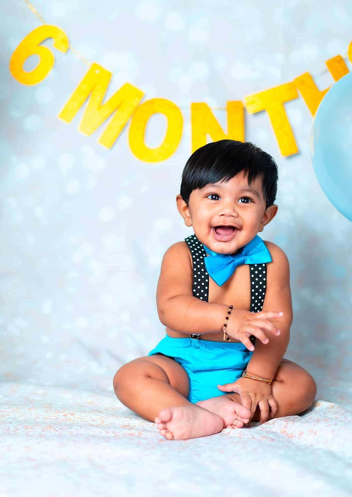 Zyaire is registered to the contest to win money with this photo: baby, baby_toddler_clothing, balloon, child, electric_blue, flash_photography, font, foot, fun, happy, leisure, pattern, people_in_nature, person, playing_with_kids, portrait_photography, sitting, skin, sleeve, smile