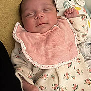 Mïa participe au concours pour gagner de l'argent avec cette photo : baby, infant, newborn, sleeping, bib, floral, onesie, pink, cozy, closeup, peaceful, cheek, hand, small_hand, soft_texture, portrait, nursery, blanket, cute, pacifier