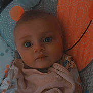 Clementine joined the competition — help win amazing prizes! baby, bib, blue, child, clothing, colorful, cozy, cute, expression, eyes, face, indoors, infant, orange, patterned, person, portrait, seat, soft_lighting, young