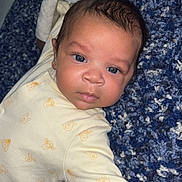 Cairo-Cruz joined the competition — help win amazing prizes! baby, infant, blue_eyes, onesie, carpet, textured, lying_down, cute, face, person, child, indoors, clothing, pattern, soft, young, skin, head, expression, curious