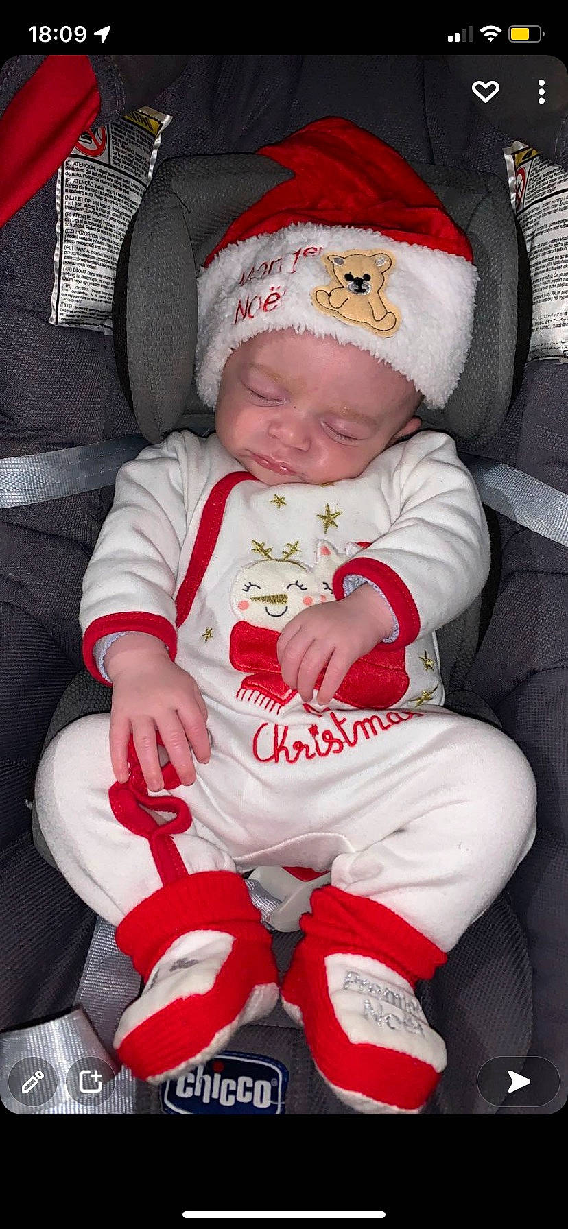 Adriann participe au concours pour gagner de l'argent avec cette photo : baby, baby_toddler_clothing, cap, car_seat, carmine, cheek, child, christmas, comfort, headwear, human_leg, knee, lap, person, red, seat_belt, sitting, sleeve, sock, thigh