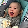 Naveen is registered to the contest to win money with this photo: baby, smiling, infant, pacifier, blanket, car_seat, clothing, happy, face, person, child, cute, young, indoors, soft_toy, comfort, closeup, head, expression, joy
