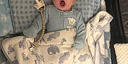 Naveen joined the competition — help win amazing prizes! baby, infant, blanket, pacifier, yawning, animal_print, bedding, plush_toys, sleepwear, cute, child, indoors, resting, comfort, soft, blue, white, newborn, lying_down, peaceful