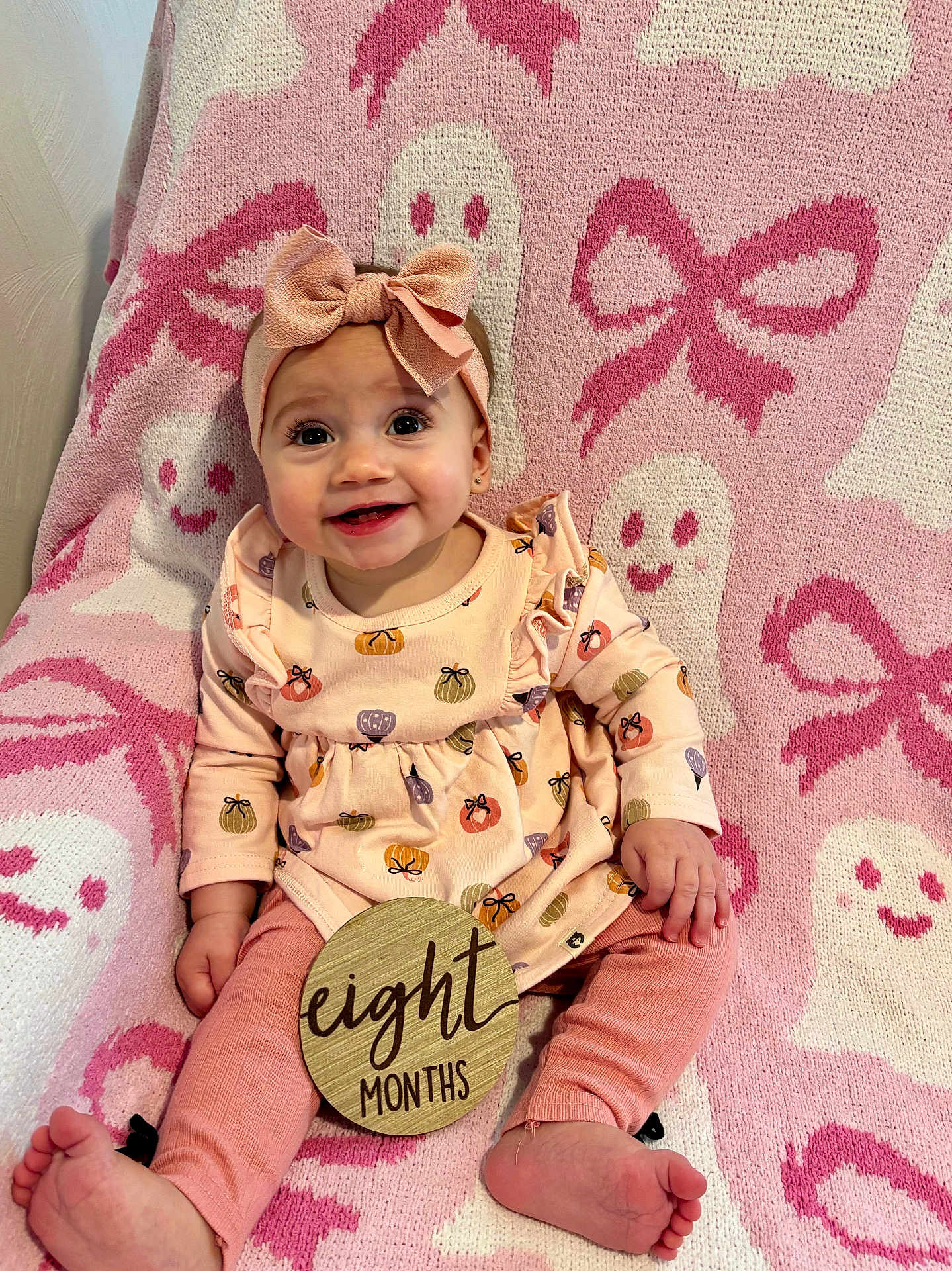 Cecilia joined the competition — help win amazing prizes! baby, infant, child, smile, headband, bow, dress, pumpkin, pink, blanket, pattern, ghost, feet, hand, wooden_sign, months, sitting, cute, happy, indoors