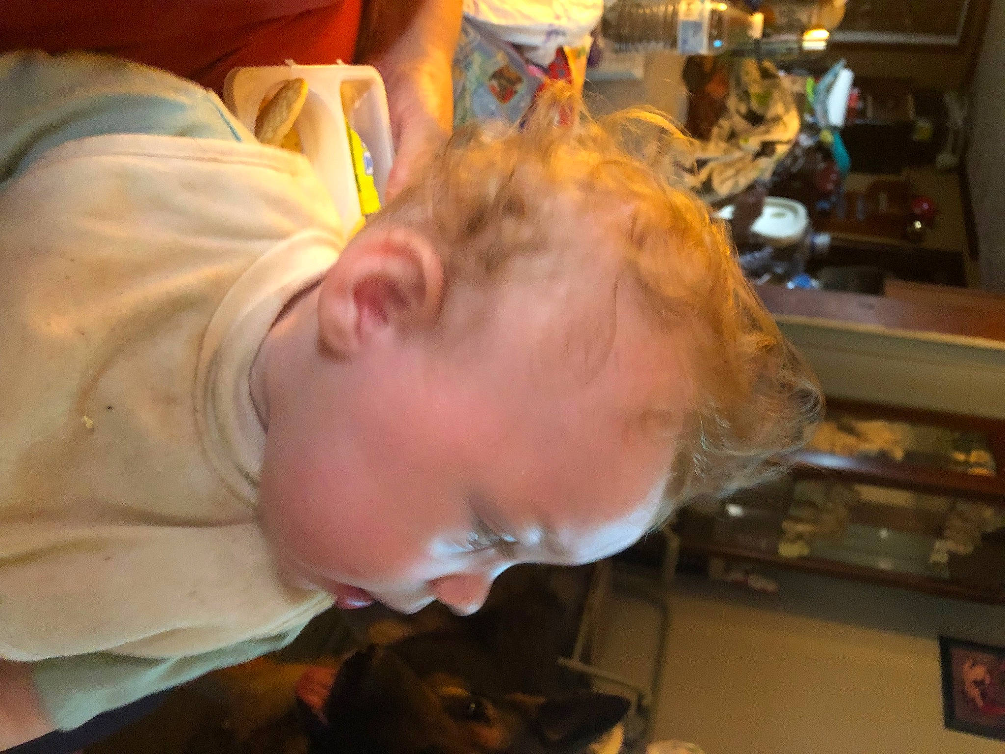 River is registered to the contest to win money with this photo: child, ear, eyewear, fast_food, flesh, fun, fur, hair_coloring, jaw, mouth, person, room, t_shirt, toddler