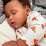 baby, blanket, child, close_up, cozy, curly_hair, cute, earring, hand, indoors, infant, pajamas, peaceful, pillow, pizza_pattern, portrait, resting, skin, sleeping, soft_fabric