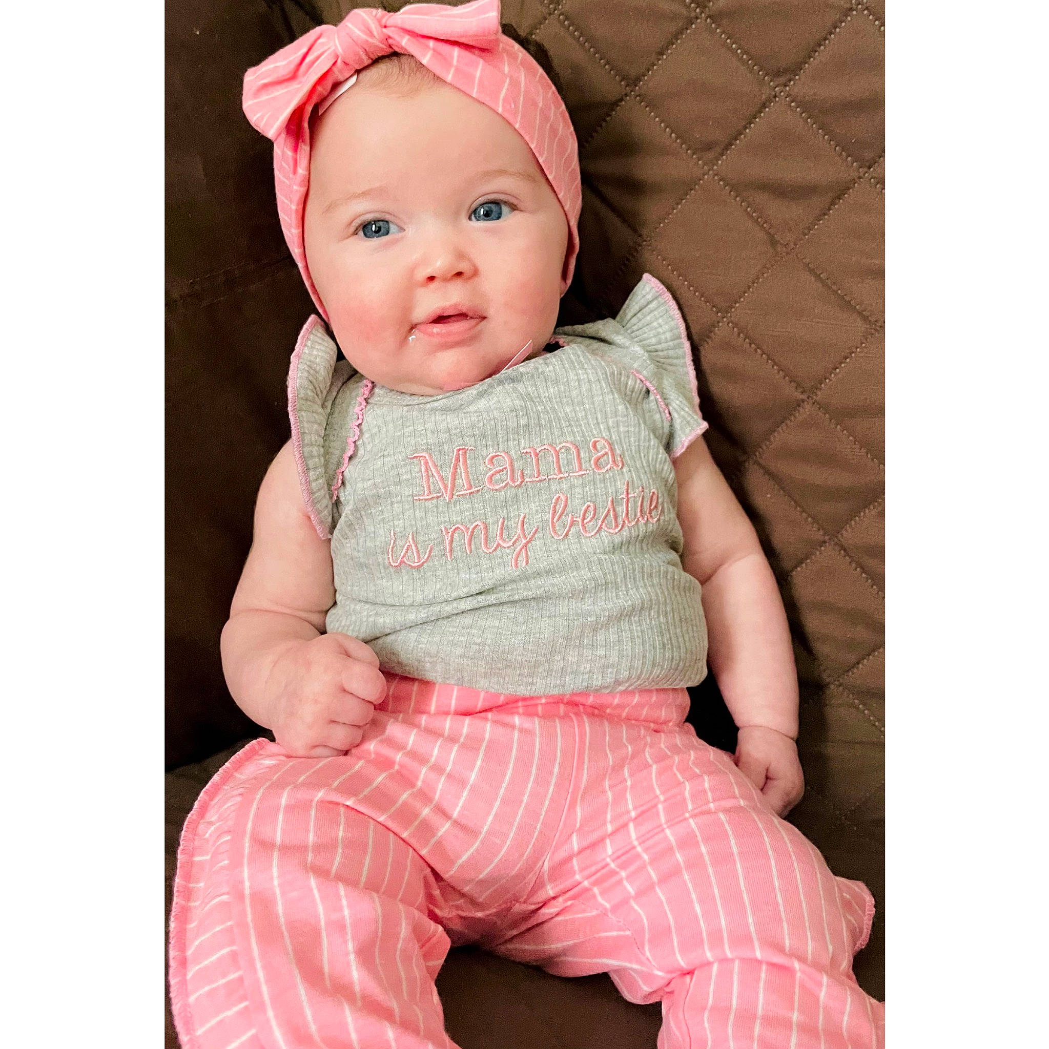 Hadley is registered to the contest to win money with this photo: baby, baby_toddler_clothing, cap, cheek, chin, comfort, costume_hat, eye, face, happy, headwear, human_body, magenta, neck, person, pink, product, skin, sleeve, smile
