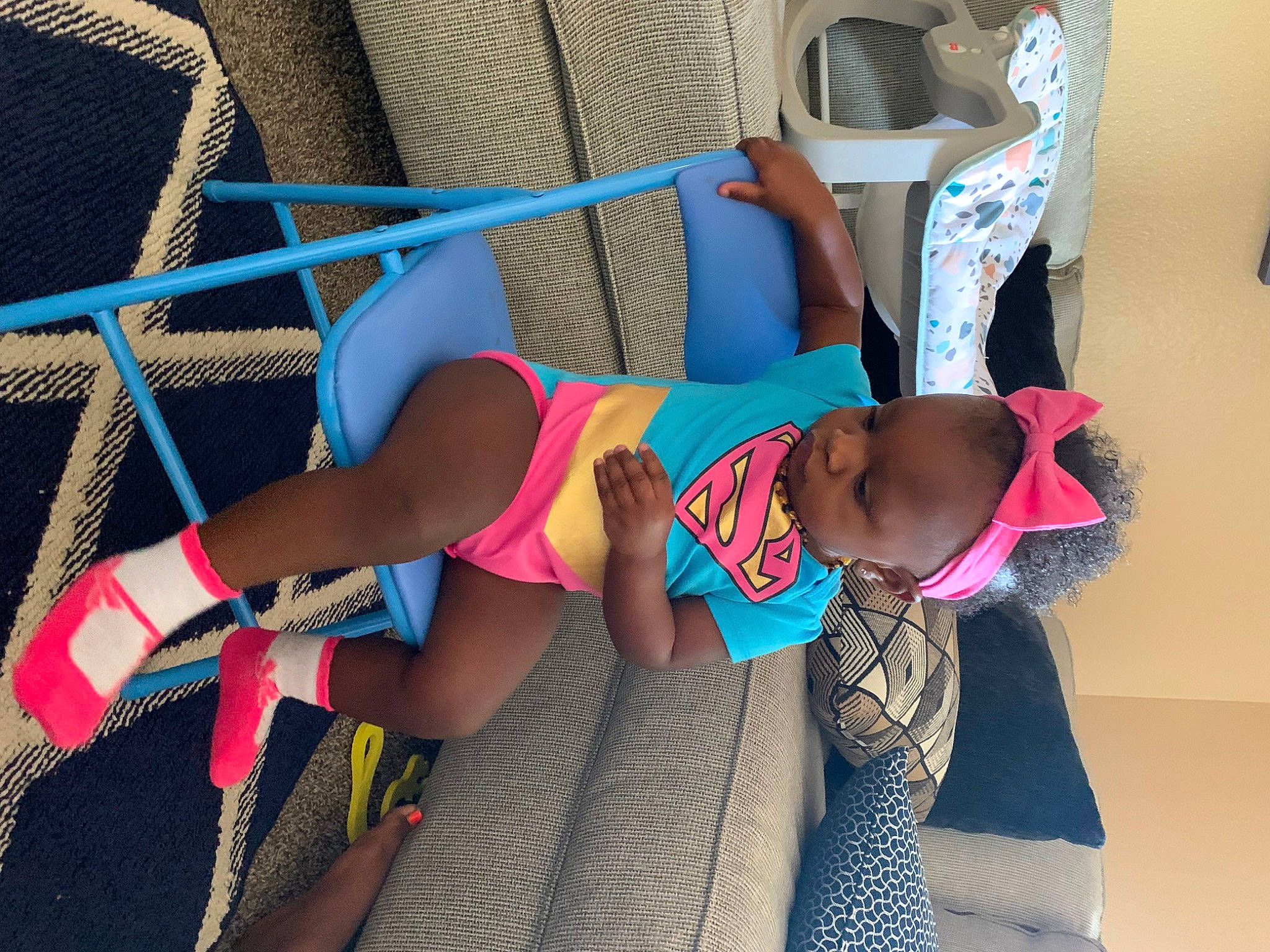 Khailani is registered to the contest to win money with this photo: baby, brassiere, eyewear, flip_flops, foot, fun, glasses, human_leg, knee, leg, leisure, person, sandal, sock, sportswear, sunglasses, swimwear, textile, thigh, toddler