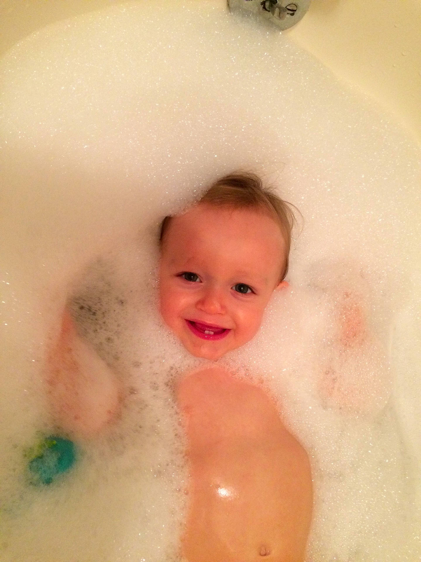 Ryland is registered to the contest to win money with this photo: barechestedness, bathing, bathtub, cheek, child, fun, girl, infant, joy, person, skin, smile, toddler