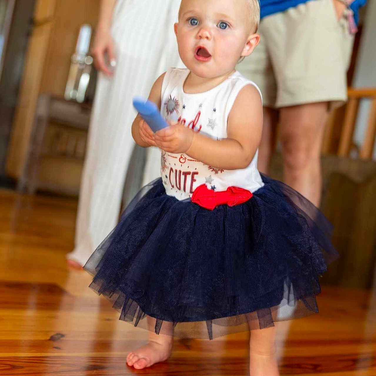 Maybelle is registered to the contest to win money with this photo: baby, bodypart, child, clothing, dancing, dress, face, female, finger, girl, hand, hardwood, head, leisureactivities, pants, person, photography, portrait, skirt, wood