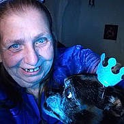 Gizmo joined the competition — help win amazing prizes! woman, dog, portrait, indoor, blue_crown, smile, pet, happy, face, animal, head, celebration, friendship, costume, closeup, adult, casual, human, furry, companionship