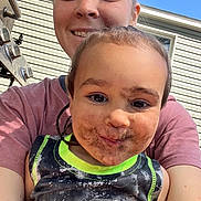 Cash joined the competition — help win amazing prizes! child, adult, selfie, smiling, mud, dirt, outdoor, sunny, tank_top, face, happy, person, playful, grass, daylight, house, window, casual_clothing, closeup, family