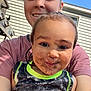 child, adult, selfie, smiling, mud, dirt, outdoor, sunny, tank_top, face, happy, person, playful, grass, daylight, house, window, casual_clothing, closeup, family
